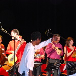 Celso conducting a guitar orchestra